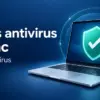 Illustrasjon av en bærbar datamaskin med et turkist sikkerhetsskjold og teksten «Gratis antivirus til Mac – AVG AntiVirus» på mørkeblå bakgrunn.